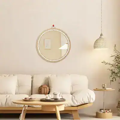 Bright minimalist living room with a cozy white sofa, stylish decor, and a round mirror from Monalisa Store enhancing modern interior design.
