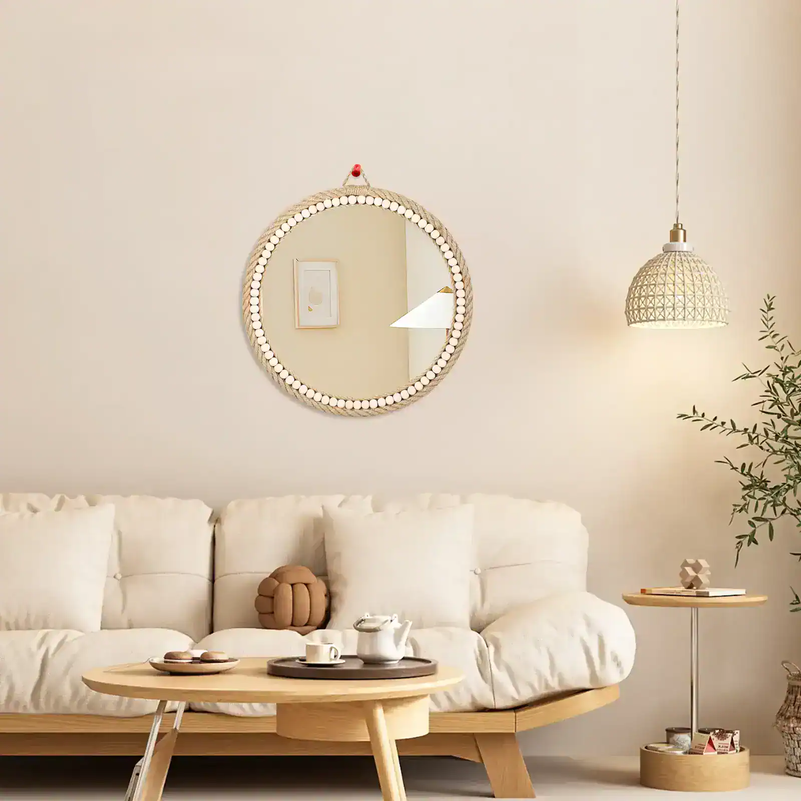 Bright minimalist living room with a cozy white sofa, stylish decor, and a round mirror from Monalisa Store enhancing modern interior design.