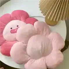 Pink plush flower-shaped cushion with a smiling face, decorative home accent, adorable pillow for kids and adults, comfortable soft fabric, Monalisa Store home decor collection.