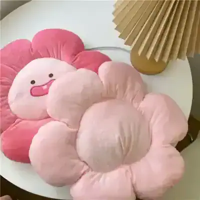 Pink plush flower-shaped cushion with a smiling face, decorative home accent, adorable pillow for kids and adults, comfortable soft fabric, Monalisa Store home decor collection.
