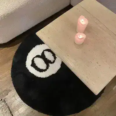 Cozy black and white smiley face rug with candles on beige side table, modern home decor for relaxing space, Monalisa Store.