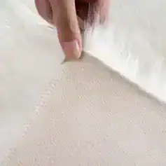 Breathable medical mesh fabric with soft texture, ideal for medical and aesthetic applications, featuring fine detailed surface for comfort and precision in use.