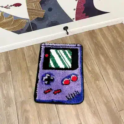 Colorful handcrafted video game controller door mat with pixel art design, ideal for gaming enthusiasts, enhances home decor, and offers a fun entrance accent.