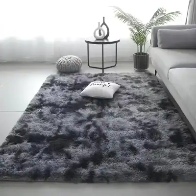 Luxurious dark gray plush area rug with a soft, shaggy texture, perfect for modern living room decor, creating a cozy and stylish ambiance.