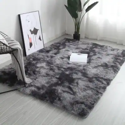 Luxurious gray plush area rug in modern interior decor, perfect for living rooms or bedrooms, featuring soft, high-pile texture.