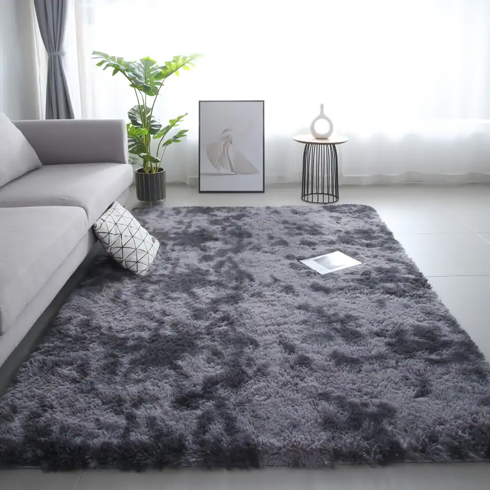 Luxurious gray shaggy area rug in modern living room with white sofa, decorative pillow, indoor plant, minimalist artwork, and side table with vase, perfect for cozy interiors.