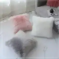 Pink and gray fluffy decorative pillows at Monalisa Store, chic and cozy home decor, perfect for living rooms or bedrooms, luxurious soft fur cushions for comfort and style, added elegance.