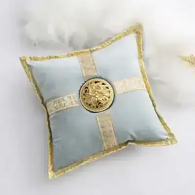 Luxurious white and gold decorative cushion featuring intricate gold embroidery, ornate center medallion, perfect for elegant home décor and special occasions.