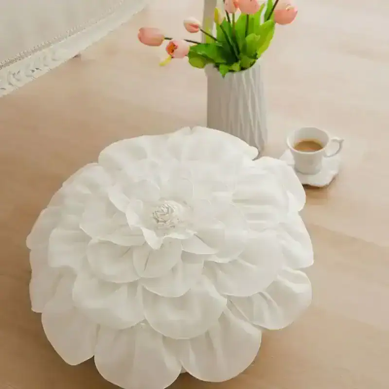 White flower-shaped tissue box cover for home decor and aesthetics.
