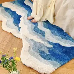 Vibrant blue and cream abstract area rug with textured shag pile, perfect for living rooms or bedrooms, adding stylish comfort and cozy aesthetic.