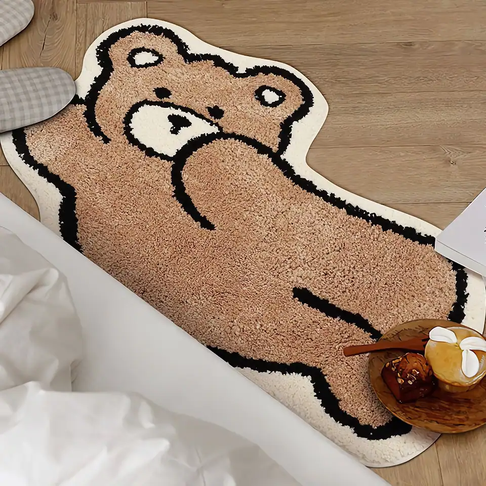 Cute bear-shaped plush rug for kids' bedrooms or play areas, adding cozy charm and warmth to any space with soft, plush texture.