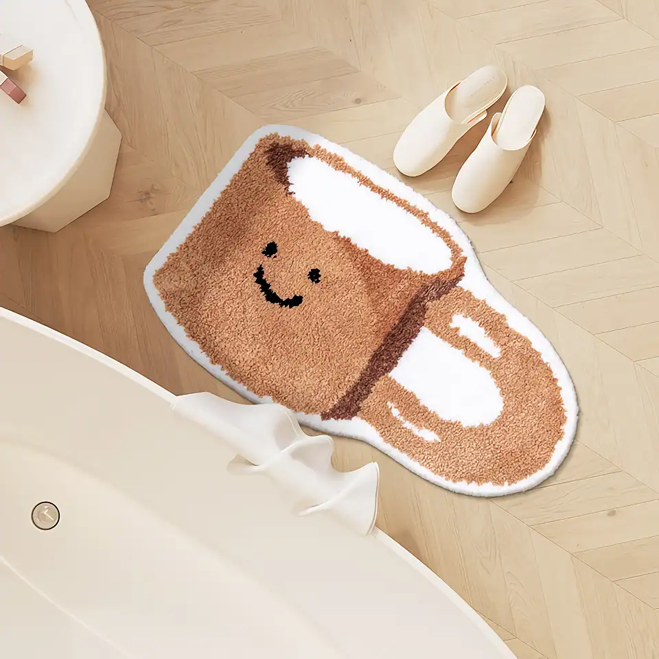 Coffee mug-shaped plush rug with a smiling face, perfect for cozy home decor and adding a playful touch to your living space. Made from soft, plush material, ideal for bedrooms or coffee stations.