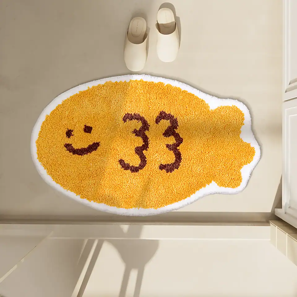 Bright yellow smiley face bath mat with "333" pattern, designed for a cheerful bathroom decor, perfect for family homes and kids' bathrooms.