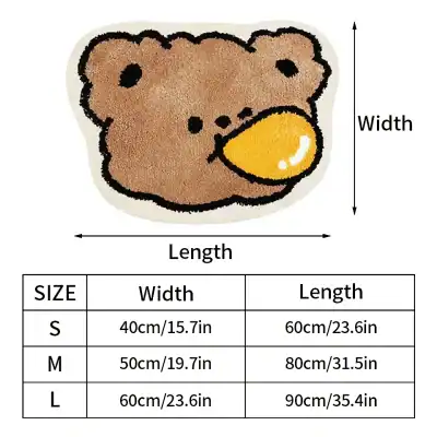 Soft teddy bear-shaped rug featuring a cute bear face with a yellow nose, perfect for children's bedrooms or nurseries. Durable material with size options suitable for various spaces.