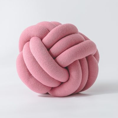 Pink knitted knot stress ball for relaxation and therapy, made of soft fabric, ideal for stress relief and hand exercises.