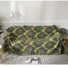 Yellow and navy floral patterned sofa cover showcasing stylish and protective furniture coverings at Monalisa Store for home decor enhancement.