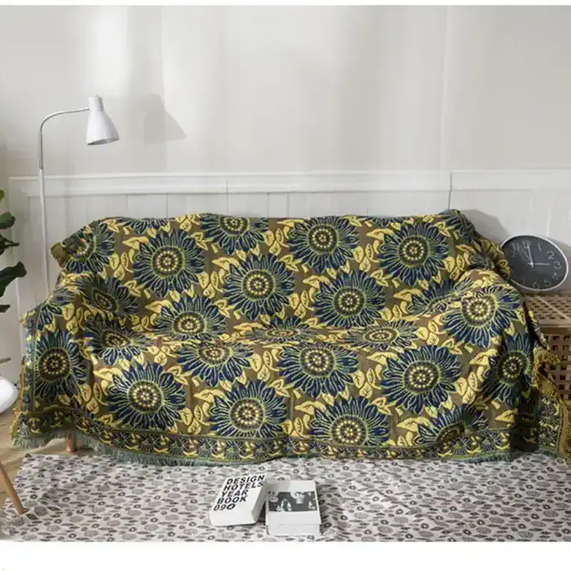 Yellow and navy floral patterned sofa cover showcasing stylish and protective furniture coverings at Monalisa Store for home decor enhancement.