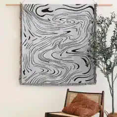 Contemporary black and white abstract wall hanging with organic flow design, ideal for stylish home decor and modern interior aesthetics.