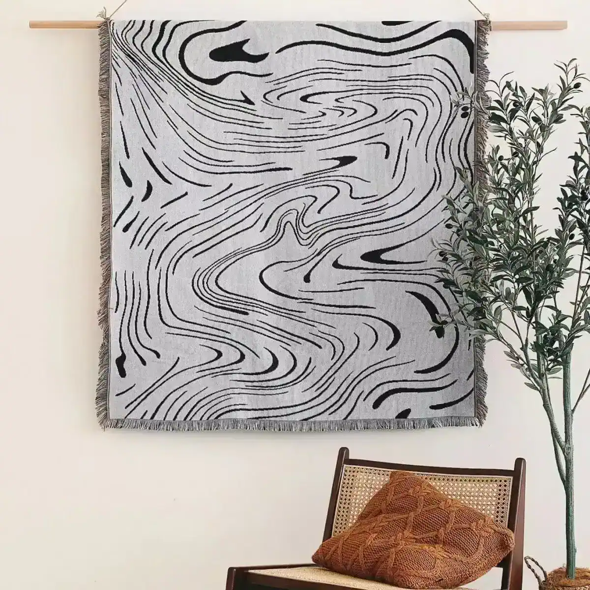 Contemporary black and white abstract wall hanging with organic flow design, ideal for stylish home decor and modern interior aesthetics.