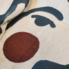 Blue and red patterned fabric with bold circular and abstract shapes, perfect for stylish clothing or accessories from Monalisa Store.