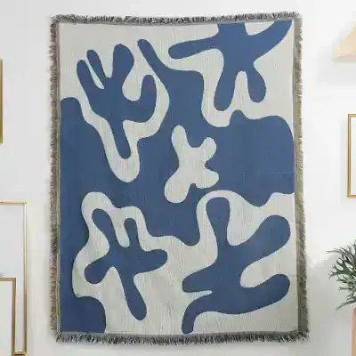 Vivid blue and white abstract area rug with organic shapes, perfect for modern home decor and adding a stylish touch to living rooms or bedrooms. High-quality and versatile design.