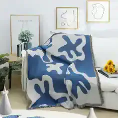 Silk throw blanket with abstract blue and white design on a white sofa, modern living room decor, Monalisa Store decorative cozy home accents, stylish and elegant home accessories, luxury interior style.
