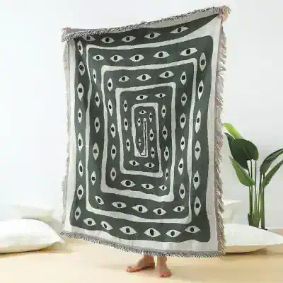 Handwoven black and white eye pattern throw blanket from Monalisa Store, perfect for home decor and stylish bedding, made of soft, high-quality fabric, ideal for adding a modern touch to your living space.