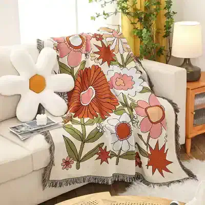 Colorful floral throw blanket with large flower patterns ideal for cozy home decor in living rooms and bedrooms.