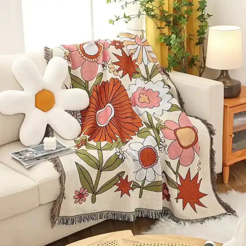 Colorful floral throw blanket with large flower patterns ideal for cozy home decor in living rooms and bedrooms.