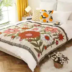Colorful floral decorative throw blanket with fringed edges, perfect for bedroom decor and cozy comfort.