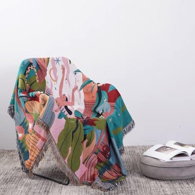 Vibrant decorative throw blanket with tropical and abstract patterns, perfect for enhancing home decor and adding a pop of color.