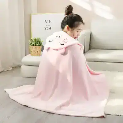 Soft pink plush hooded blanket with cute cloud and heart details, perfect for cozy naps and bedtime comfort for kids.