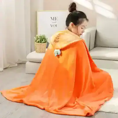 Cozy orange hooded blanket with cute animal design, perfect for relaxing and staying warm at home. Soft, plush material adds comfort and style to your lounge area or bedroom.