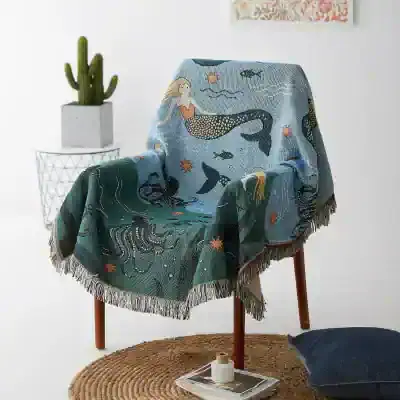 Luxurious mermaid-themed throw blanket with ocean-inspired motifs, ideal for cozy home decor and enhancing your living space ambiance. Perfect for adding a nautical touch to any room.