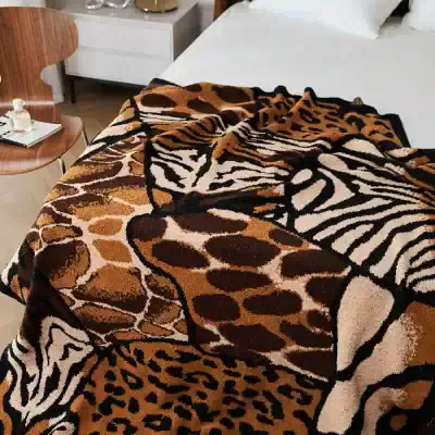 Giraffe and zebra animal print blanket, stylish bedroom decor at Monalisa Store in Dubai. Perfect for adding exotic animal patterns to your home or bedroom decoration.