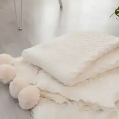 Luxury white plush blankets and pillows for sleep and comfort, high-quality bedding accessories from Monalisa Store.