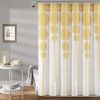 Elegant yellow and white decorative curtain with intricate pattern, perfect for enhancing bedroom or living room decor.