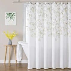 Soft white botanical curtain with leaf pattern for window decor in bedroom or living room, ideal for creating a light and airy atmosphere.