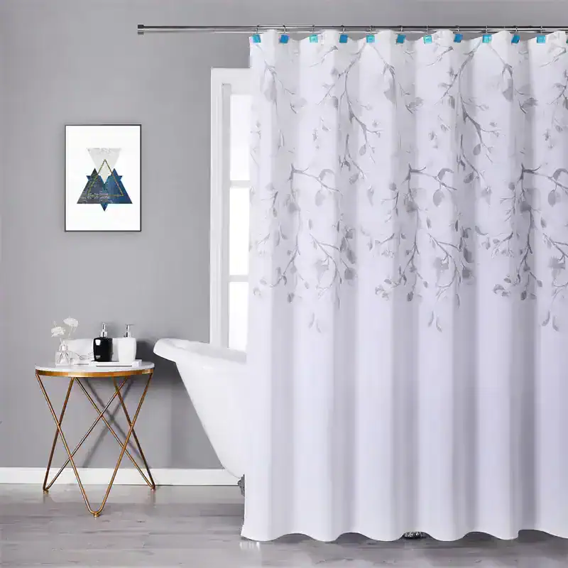 Soft white shower curtain with elegant gray floral pattern, ideal for modern bathroom decor. Made from durable, high-quality fabric for moisture resistance and privacy.