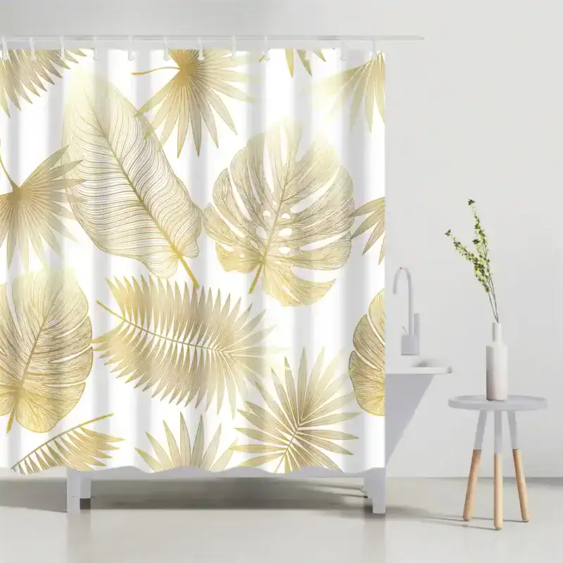 Luxurious botanical shower curtain featuring tropical leaves in soft gold tones, perfect for modern bathroom decor, adding elegance and a touch of nature-inspired style.