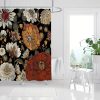 Vibrant floral shower curtain with bold black background, perfect for modern bathroom decor, featuring large orange, beige, and white flowers with intricate details.