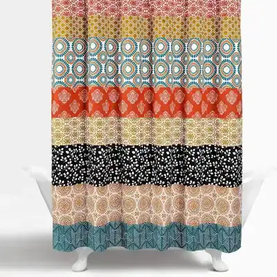 Linen fabric with colorful geometric and floral patterns in multiple strips, perfect for home decor, curtains, or DIY craft projects.
