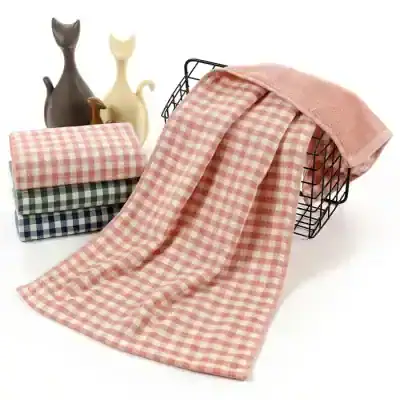 Soft pink checkered kitchen towels and dishcloths displayed on a wire basket, perfect for home use, kitchen decor, and cleaning supplies at Monalisa Medical Store.
