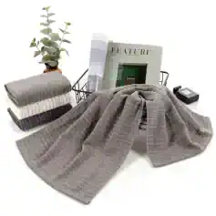 Soft striped fabric scarves displayed at Monalisa Store for stylish eyewear accessories and optical fashion. Perfect for complementing your glasses and enhancing your look.