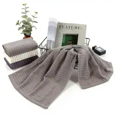 Soft striped fabric scarves displayed at Monalisa Store for stylish eyewear accessories and optical fashion. Perfect for complementing your glasses and enhancing your look.