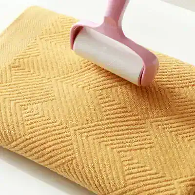 Microfiber facial roller for skincare and facial massage, pink tone, plastic handle, gentle and effective for skin rejuvenation, part of Monalisa Store's beauty and wellness collection.