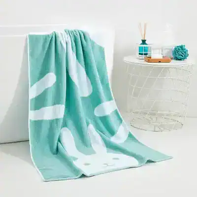 Soft turquoise bath towel with bunny face design, perfect for children’s bath or beach use. Plush, absorbent, and adorable, ideal for a fun and cozy bath time experience.