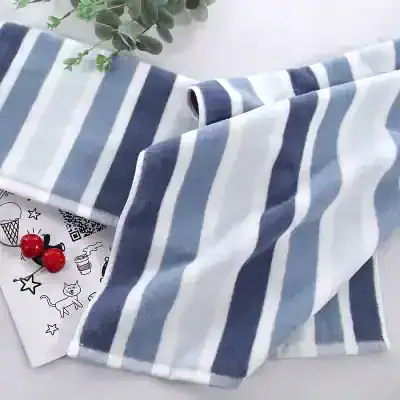 Soft blue and white striped towel, perfect for home use or gift, featuring a cozy design with plush texture. Ideal for bathroom or beach, offering comfort and style while showcasing quality fabric.
