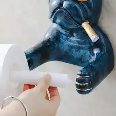 Hand holding a roll of white adhesive tape, with a blue abstract sculpture in the background, at Monalisa Store, highlighting art supplies and custom creative décor for home and office.