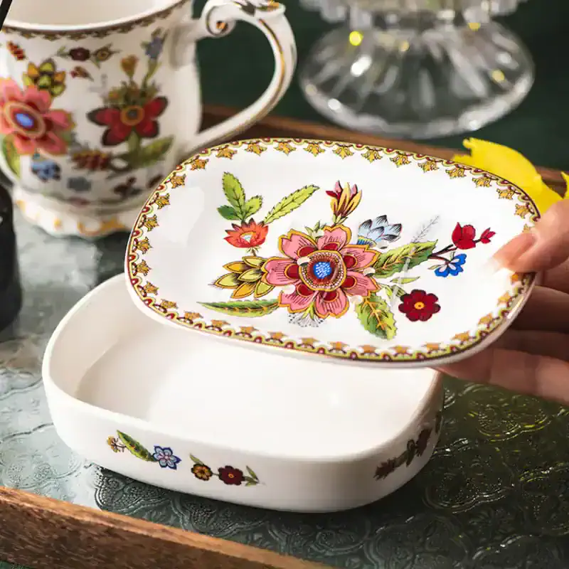 Elegant porcelain jewelry box with vibrant floral patterns, perfect for storing accessories or keepsakes, blending traditional craftsmanship with modern home decor.